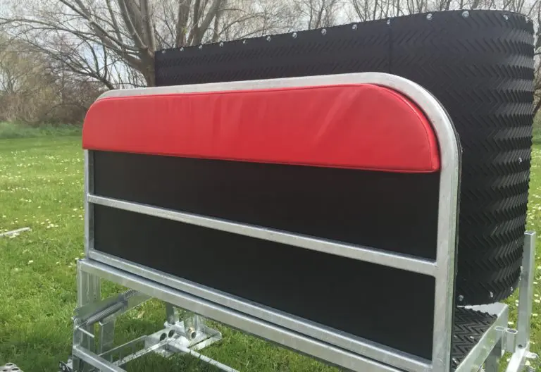 Farmer gently handling a small lamb